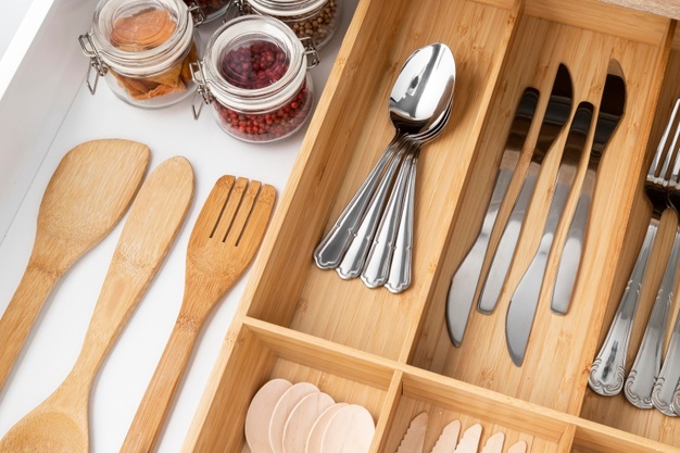 Spoons and Forks Arrangement in a Wood Drawer