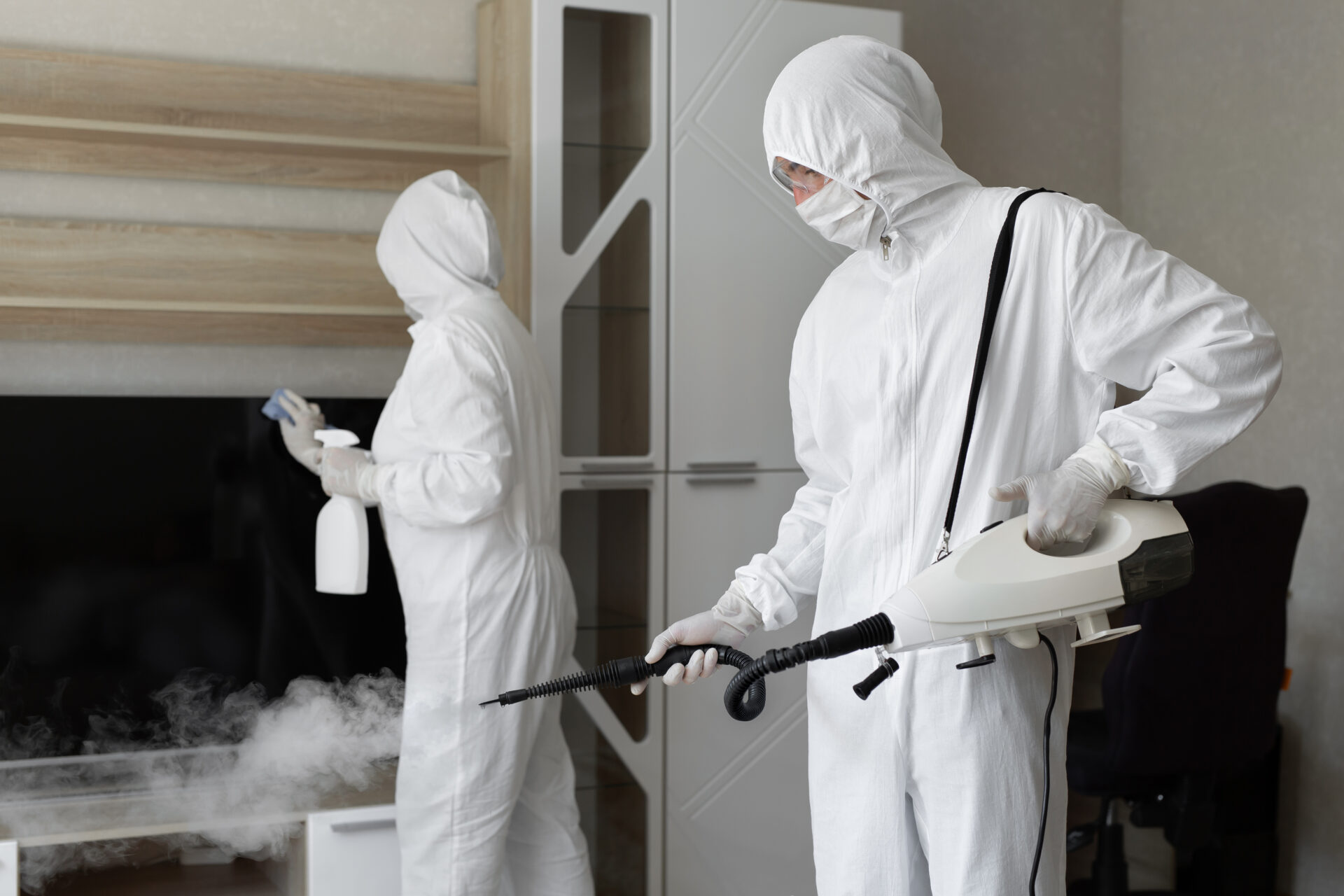 Men in White Color Aprons With Sprays